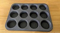 Top view of Granitestone 12-cup muffin tin showing non-stick wells