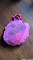 Carry bag folded flat, pink nylon with handles