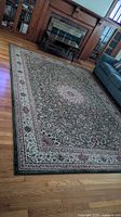 Full view of Kaoud Oriental area rug on hardwood floor