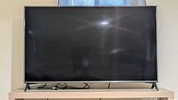 Front view of LG 55" TV on stand
