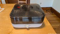 Front view of assembled Ronco dehydrator showing five trays, lid and control knob