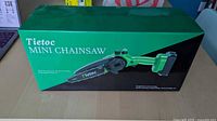Front of unopened Tietoc Mini Chainsaw box