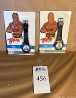 Front view showing two sealed Hulk Hogan digital watches on blister cards