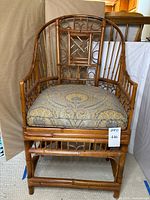 Front angled view of bamboo armchair with cushion