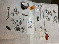 Full lot overview including gold necklace in bag and assorted sterling pieces