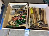 Overview of both boxes of mixed hand tools