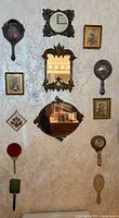 Group shot of all mirrors and wall hangings displayed on wall