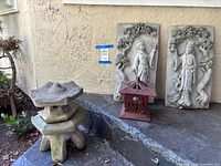 Overview of all items: two relief plaques, concrete pagoda lantern, ceramic lantern
