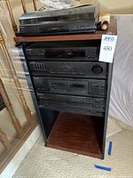 Full view of rack with turntable on top and four Sony components installed