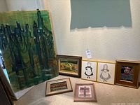 Full group of seven framed artworks