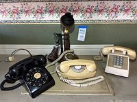 Group shot of four telephones on tray