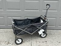 Wagon fully opened showing fabric liner, frame and wheels