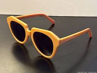 Full view of sunglasses, front and side profile