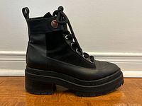 Left profile view of boot showing materials, sole, heel