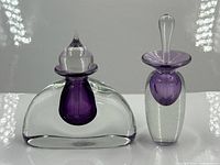Both art glass perfume bottles front view