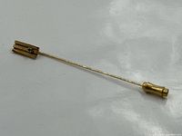 Full view of stick pin showing head, shaft and clutch