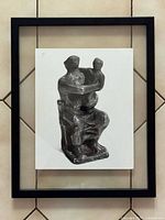 Front view of framed photograph showing sculpture within black frame