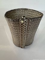 Front view of wide textured silver woven mesh cuff bracelet