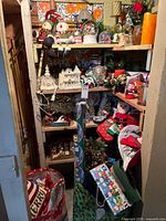 Full view of shelves packed with assorted Christmas decorations and wrapping supplies