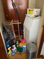 group view of all cleaning items, tools, trash can and drying rack