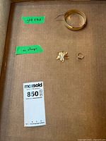 Overview of all three jewelry items in cardboard tray