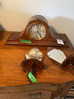 Mantel clock and both mirrored sconces on dresser
