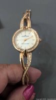 Front view of Anne Klein gold-tone crystal bangle watch