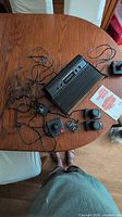 Top view of Atari 2600 console with controllers, wiring and manual