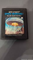 Front of Atari Space Invaders cartridge showing label