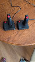 Two QuickShot 7 joysticks on tabletop