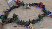 Entire garland looped on floor with multicolor lights on