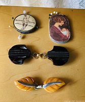 Group view of both pin holders and both bakelite clips