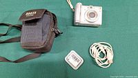 Camera, case, cable, memory card case overview