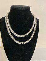 Full view of sterling silver Byzantine chain displayed on bust