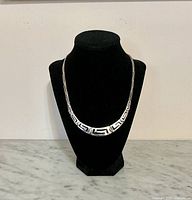 Necklace on display stand front view