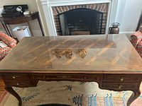 Top view of mahogany writing desk with glass top in place