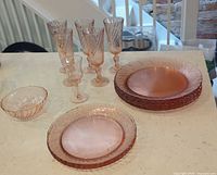 Full lot showing plates, glasses and bowl