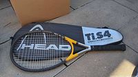 Racquet placed on top of Head Ti.S4 case