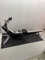 Side view of Hydrow rower on floor mat