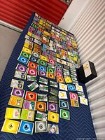 Wide shot of entire spread of Pokémon cards on table and Pikachu storage box