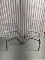 Front view of both clear IKEA Tobias chairs