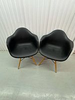 Front view of both armchairs showing overall design and condition