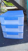 Front view of blue and clear 3-drawer plastic storage unit