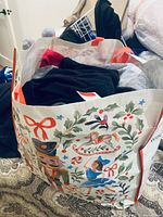 Reusable shopping bag filled with folded plus-size garments