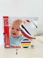 Retail box front showing product image, branding, age rating, price