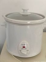 Front view of Housemax slow cooker showing control dial and lid