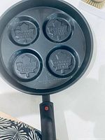 Top view of entire pan showing four logo molds