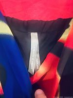 Tag inside multicolour dress