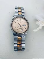 Front view of Pulsar two-tone wristwatch showing dial, bracelet and condition