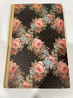 Front cover showing floral design and beige spine